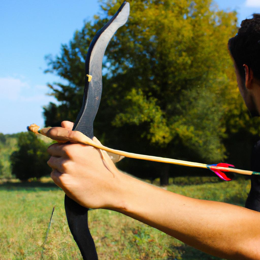 Person holding bow and arrow
