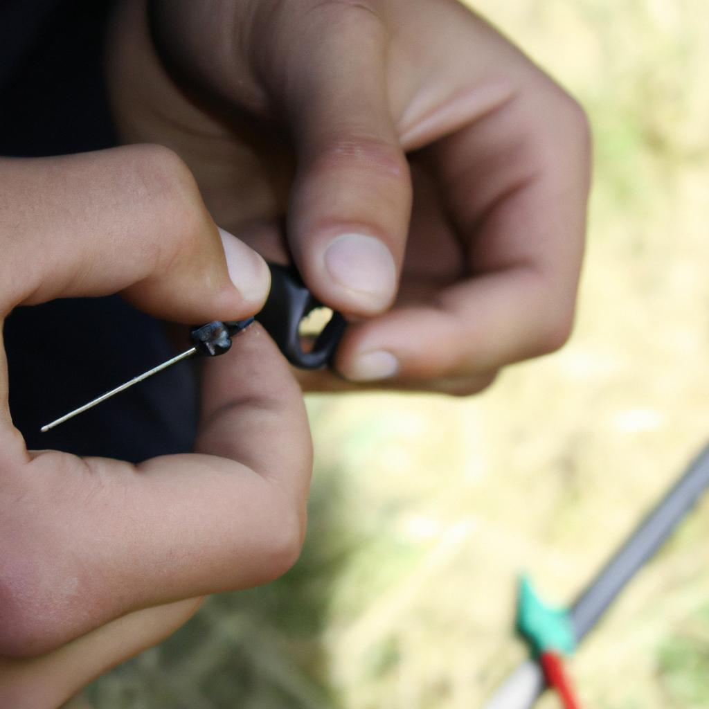 Person installing archery sight pin